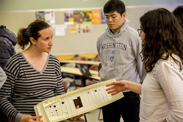 ME alumna Elizabeth Benson shows a wing box model to students