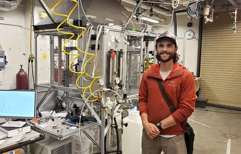 Brian Pinkard standing in a lab