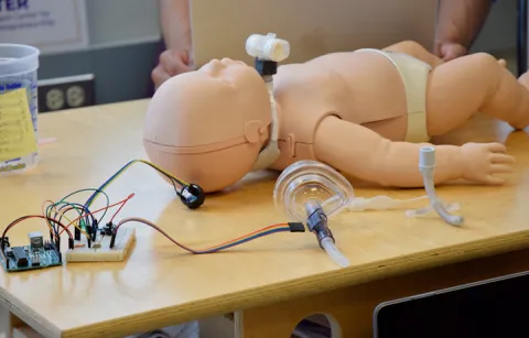 Infant CPR Manikin on a table