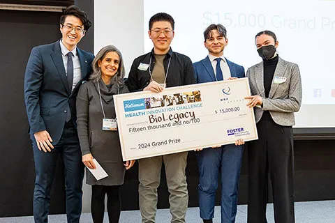 Group of people holding an award check