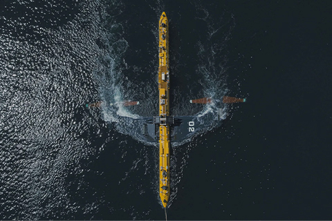 an aerial view of a yellow boat in the water